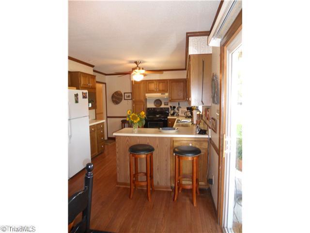 2254 Cullen Road Gibsonville, NC 27249 - Photo 7 of 16 Kitchen. Kitchen bar, stools remain