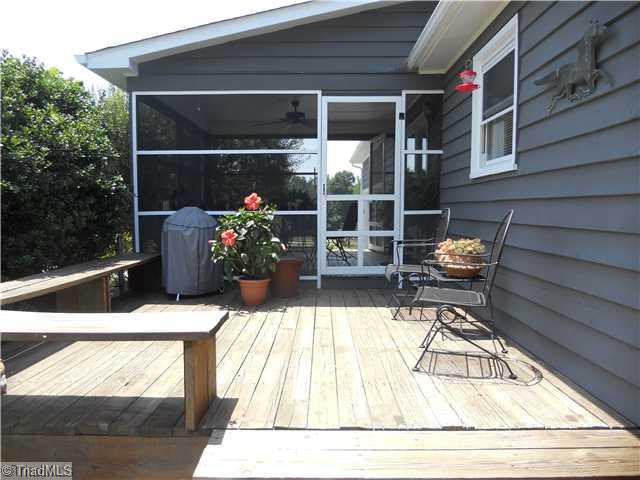 2254 Cullen Road Gibsonville, NC 27249 - Photo 8 of 16 Patio/Deck. Screened porch, adjoining deck with seating