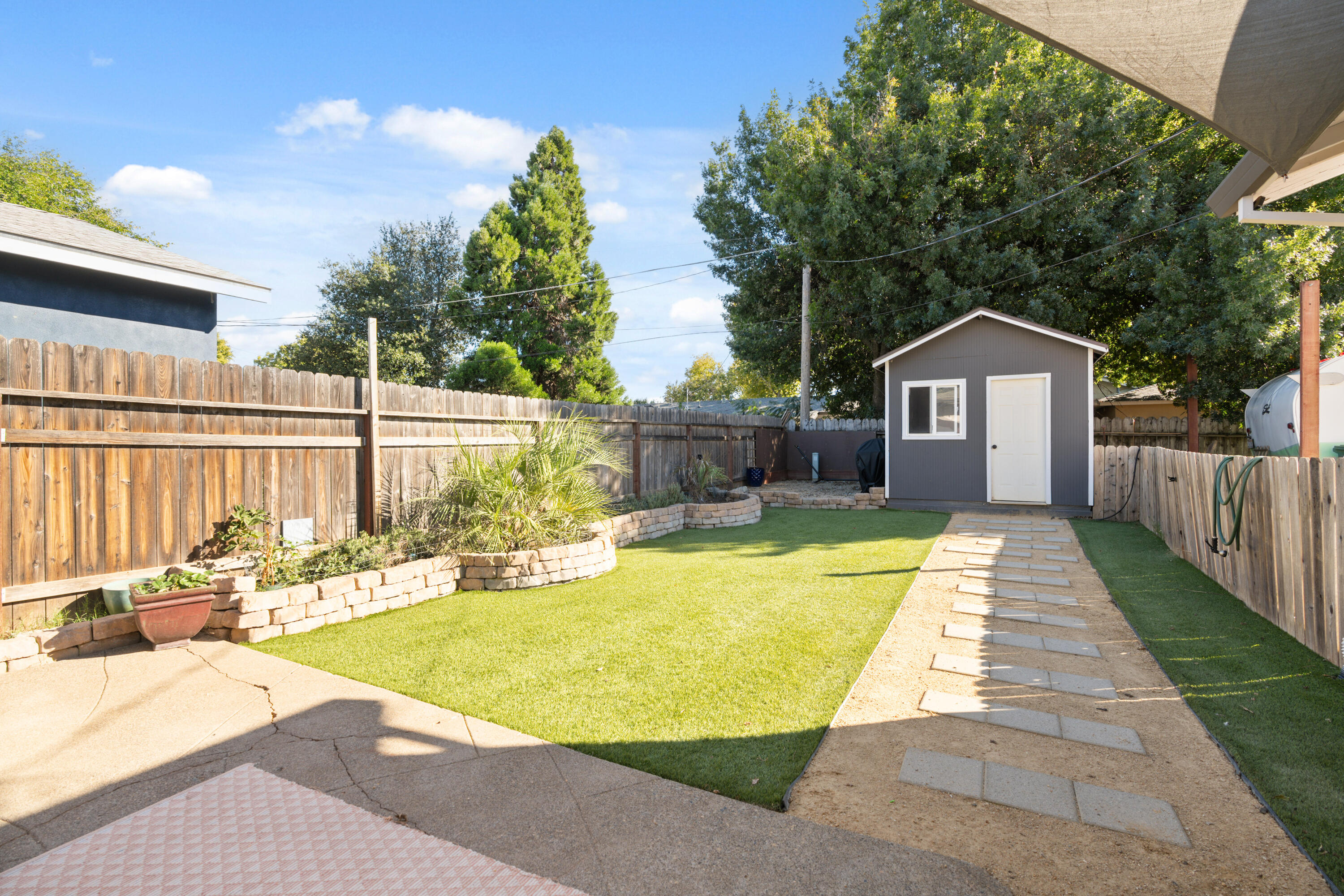 2041 Jupiter Terrace Redding, CA 96002 - Photo 19 of 32 a swimming pool with wooden fence