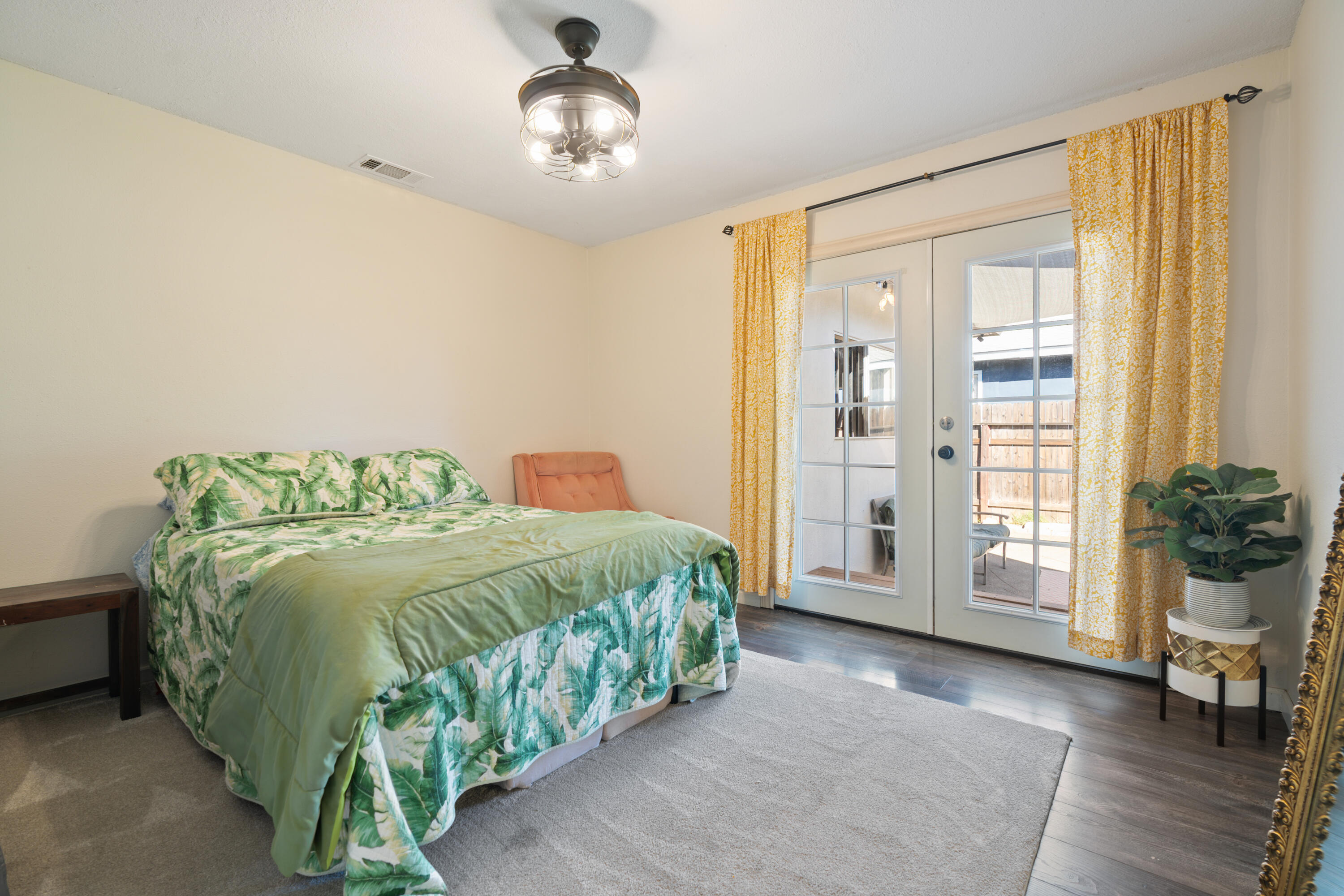 2041 Jupiter Terrace Redding, CA 96002 - Photo 2 of 32 a spacious bedroom with a bed and a chandelier