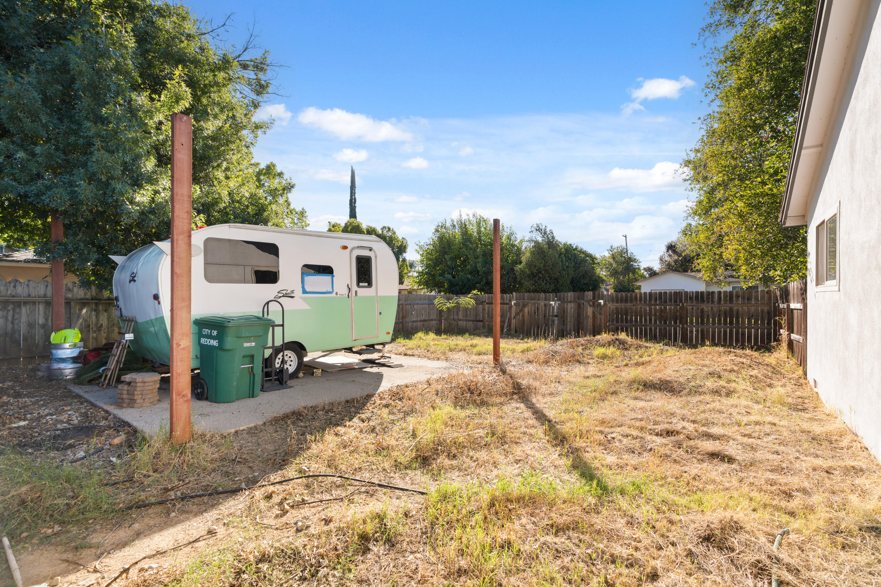 2041 Jupiter Terrace Redding, CA 96002 - Photo 23 of 32 a backyard of a house with plants and tree