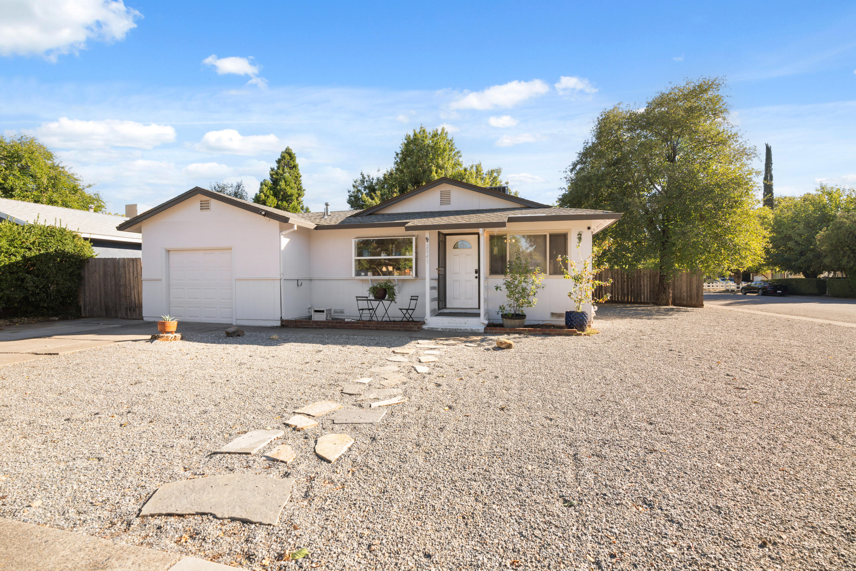 2041 Jupiter Terrace Redding, CA 96002 - Photo 26 of 32 a front view of a house with a yard