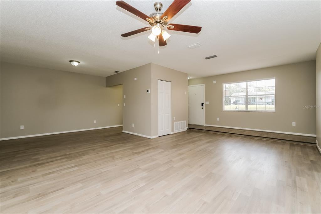 12345 Mayberry Road Spring Hill, FL 34609 - Photo 3 of 16 a view of an empty room with a window