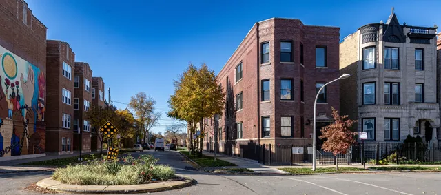 a front view of a building with a yard