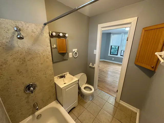 a bathroom with a sink and toilet