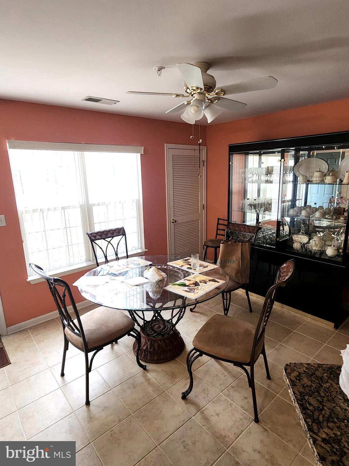 11427 Manklin Creek Road, Unit 7 Ocean Pines, MD 21811 - Photo 16 of 17 a view of a dining room with furniture window and outside view