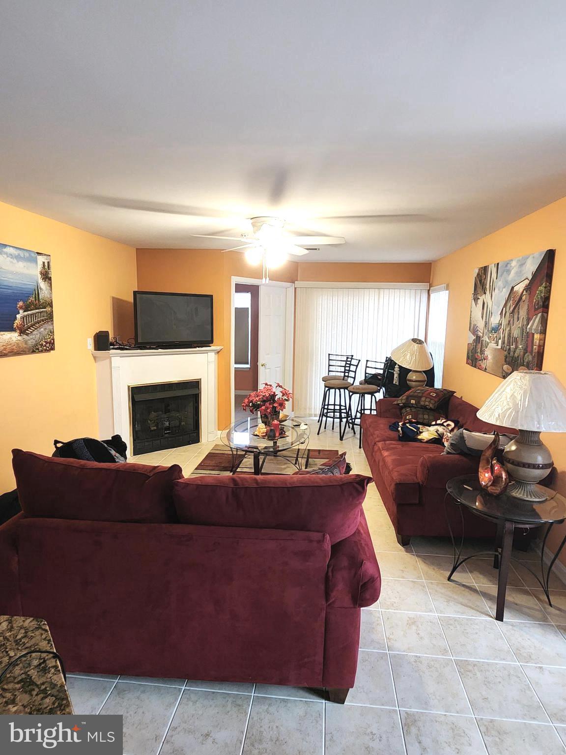 11427 Manklin Creek Road, Unit 7 Ocean Pines, MD 21811 - Photo 17 of 17 a living room with furniture and a fireplace