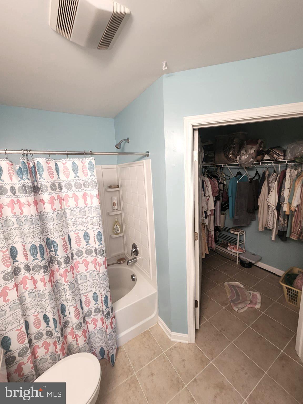 11427 Manklin Creek Road, Unit 7 Ocean Pines, MD 21811 - Photo 10 of 17 a bathroom with a shower and a toilet