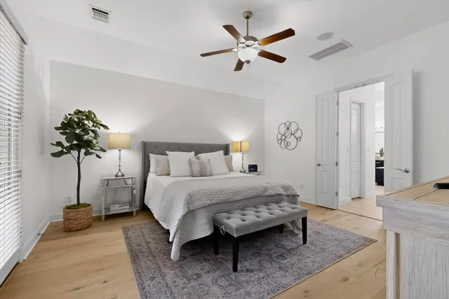 a bedroom with a bed and a table