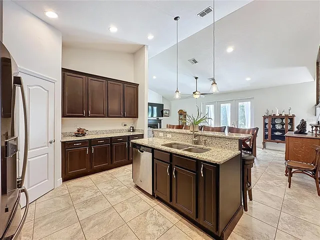 a view of a house with a yard and garage