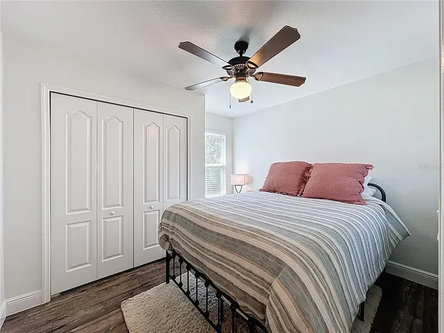 a front view of a house with a garden and plants