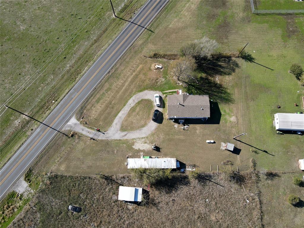 16531 Farm To Market 455 Pilot Point, TX 76258 - Photo 11 of 37 Aerial view of property and surrounding area with rural landscape and a highway