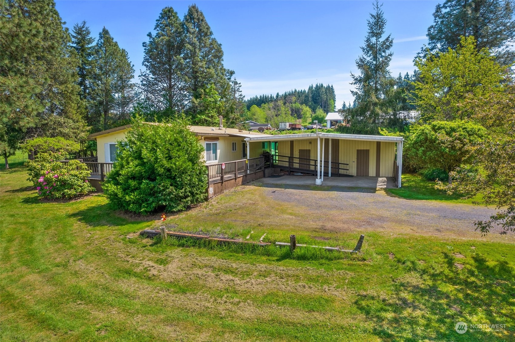 113 Coulson Road Chehalis, WA 98532 - Photo 1 of 25 a view of a house with a yard patio and fire pit