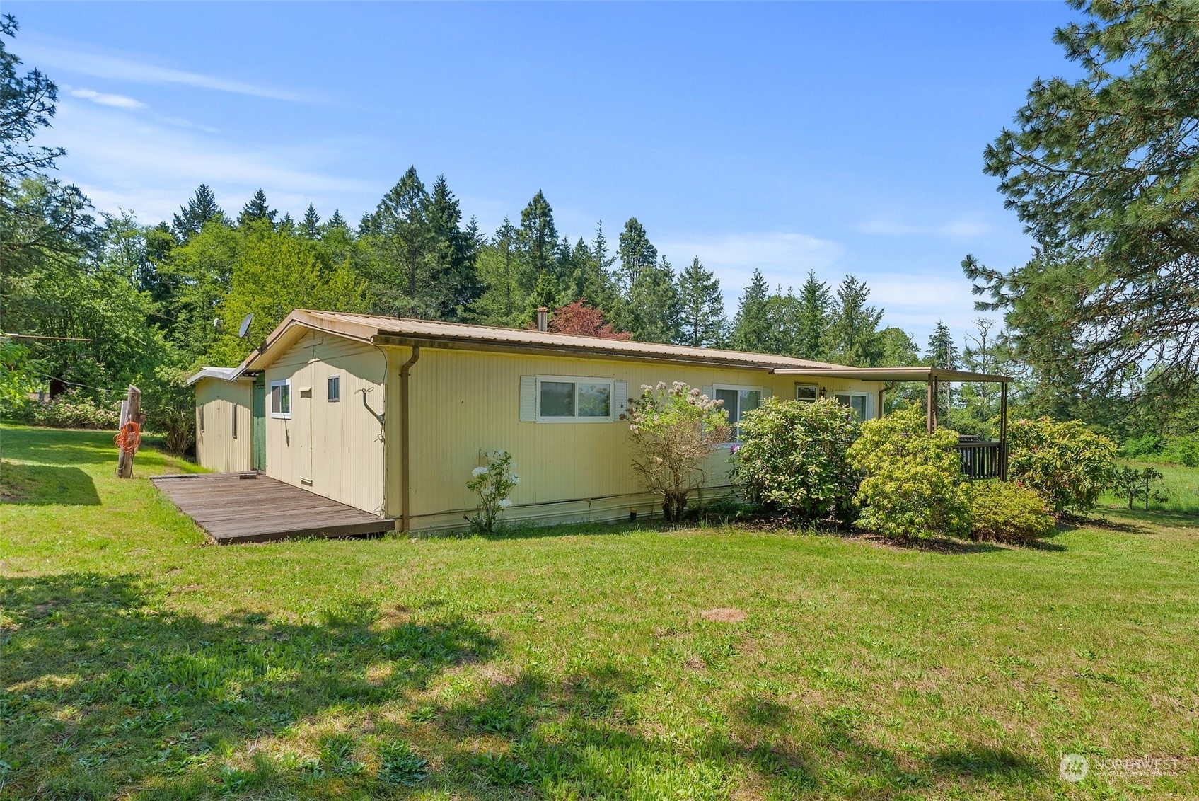 113 Coulson Road Chehalis, WA 98532 - Photo 25 of 25 a view of backyard with a garden and trees