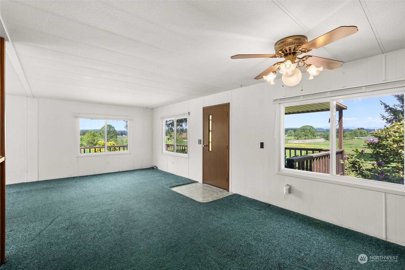 113 Coulson Road Chehalis, WA 98532 - Photo 6 of 25 a view of an empty room with window and chandelier fan