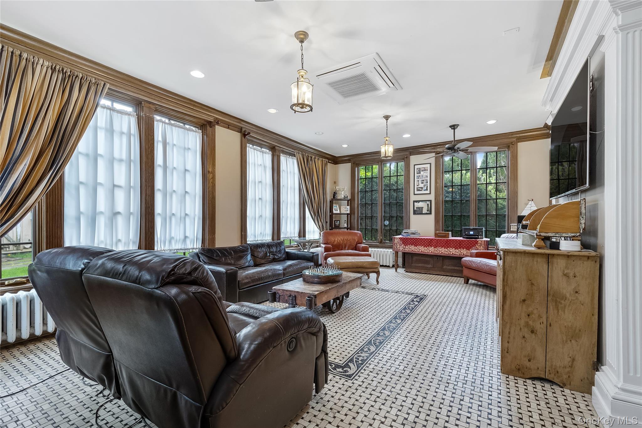 1-27 Beverly Road Queens, NY 11363 - Photo 28 of 46 a living room with furniture and a large window