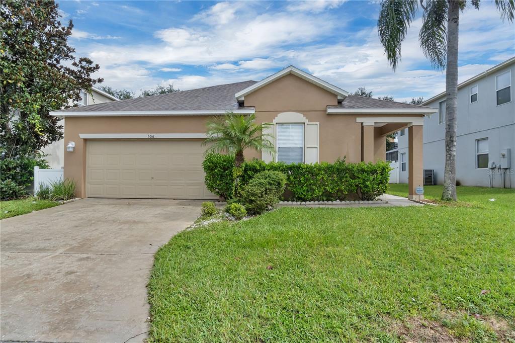 front view of a house with a yard