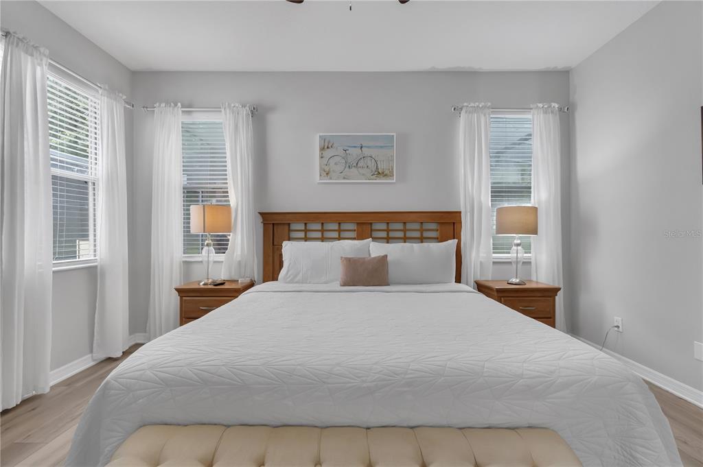 506 Kettering Road Davenport, FL 33897 - Photo 15 of 45 a bedroom with a large bed and a window