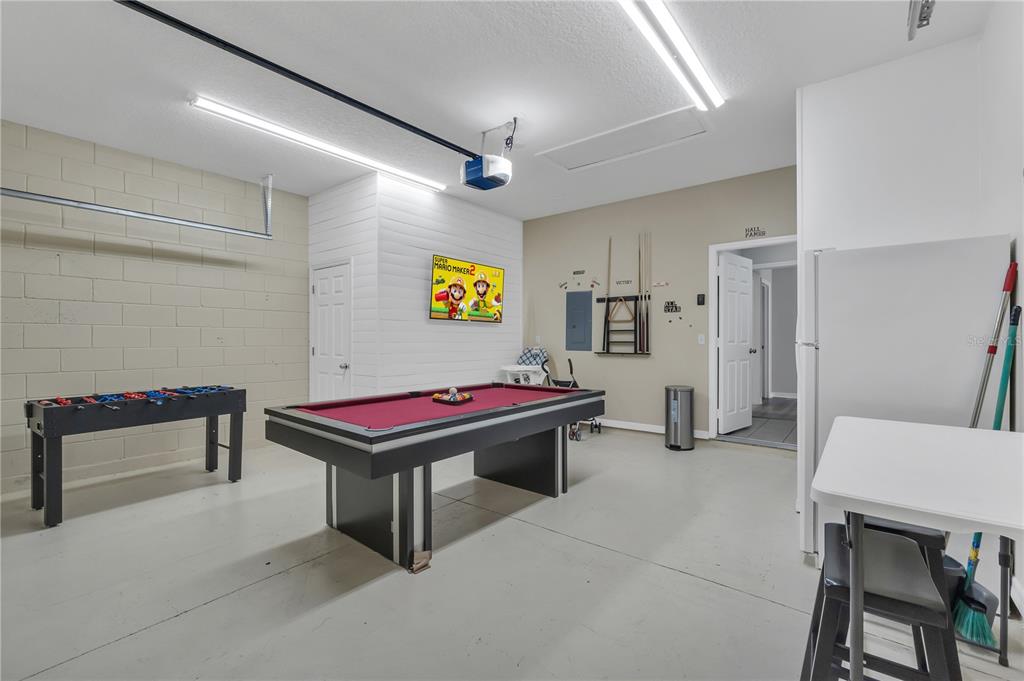 506 Kettering Road Davenport, FL 33897 - Photo 30 of 45 a room with furniture and air hockey table