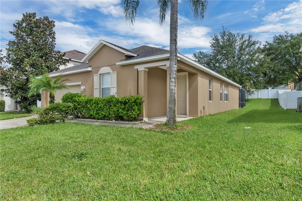 506 Kettering Road Davenport, FL 33897 - Photo 34 of 45 a front view of house with yard and green space