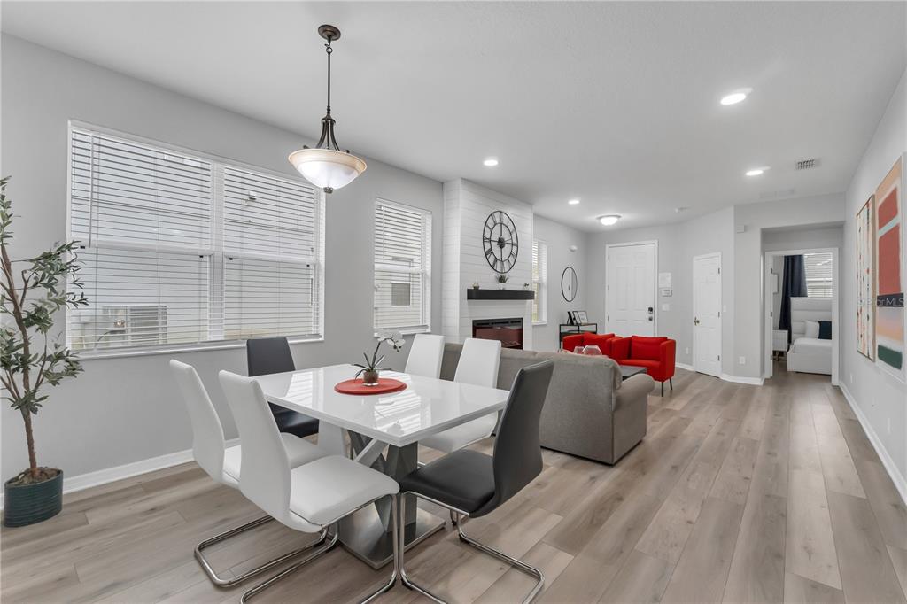 506 Kettering Road Davenport, FL 33897 - Photo 4 of 45 a living room with furniture and a table