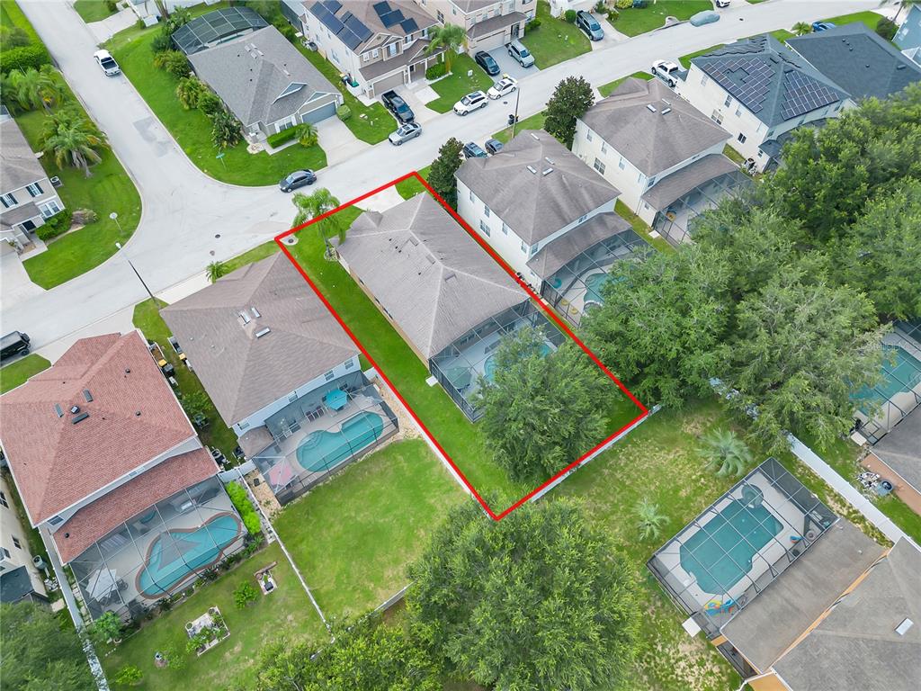 506 Kettering Road Davenport, FL 33897 - Photo 42 of 45 an aerial view of residential house with outdoor space and swimming pool