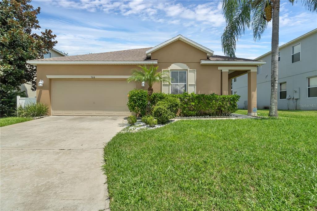 506 Kettering Road Davenport, FL 33897 - Photo 45 of 45 front view of a house with a yard