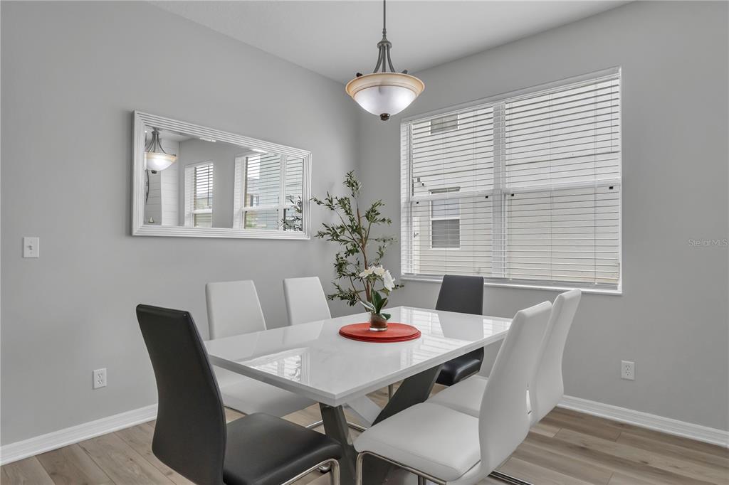 506 Kettering Road Davenport, FL 33897 - Photo 5 of 45 a dining room with furniture and window