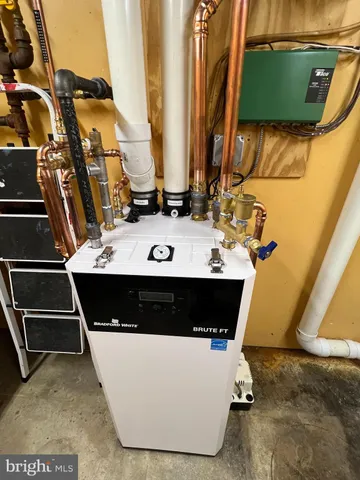 a view of walk in closet with clothes and water camper