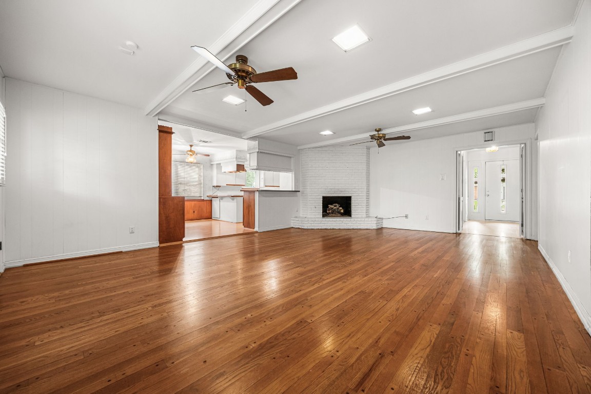 11407 Valley Spring Drive Houston, TX 77043 - Photo 16 of 32 Living room with fireplace and hardwood floors.