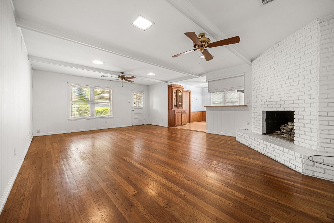 11407 Valley Spring Drive Houston, TX 77043 - Photo 17 of 32 Living room with fireplace and hardwood floors.