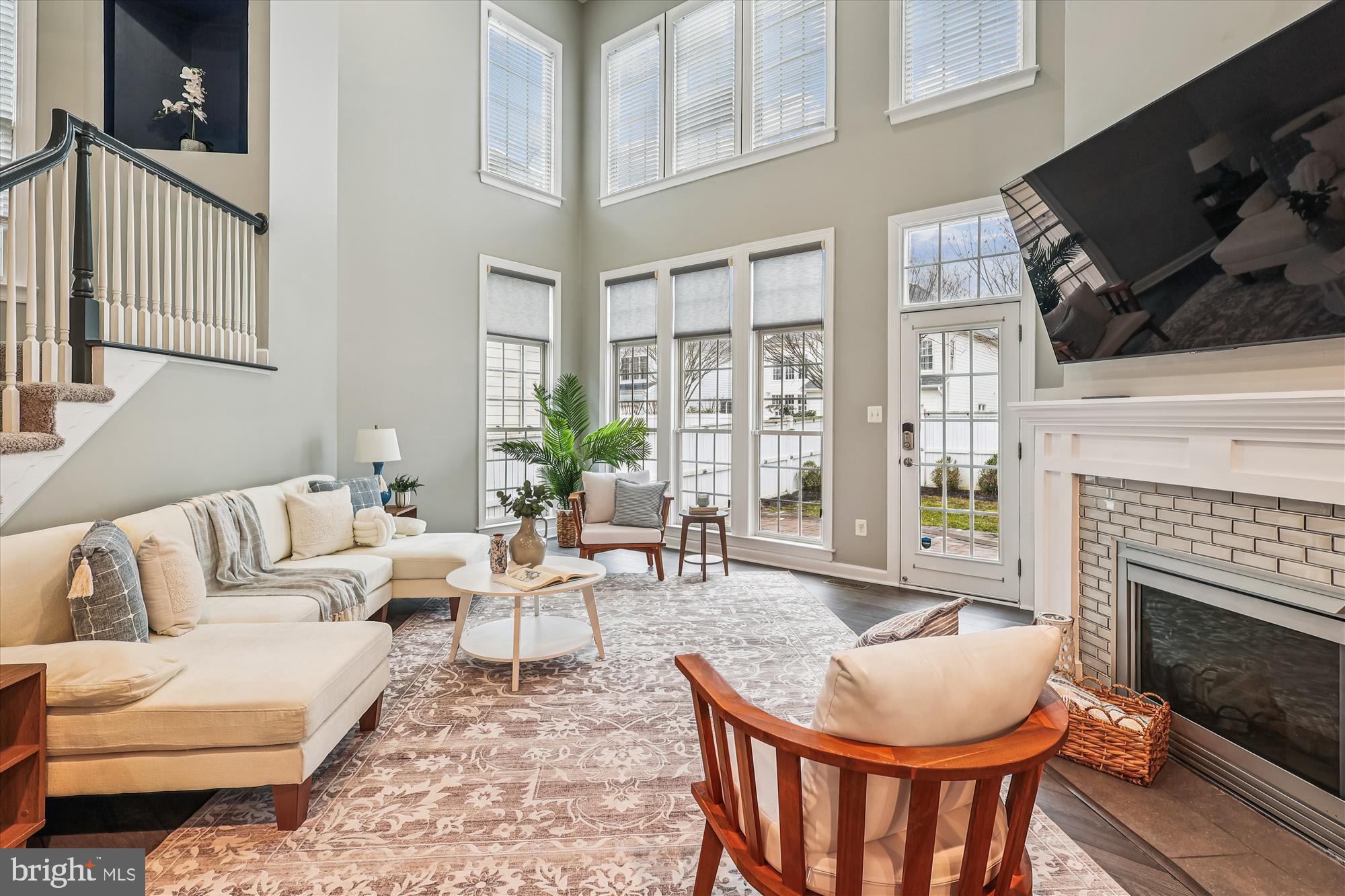 706 Crisfield Way Annapolis, MD 21401 - Photo 16 of 71 a living room with furniture a fireplace and a flat screen tv