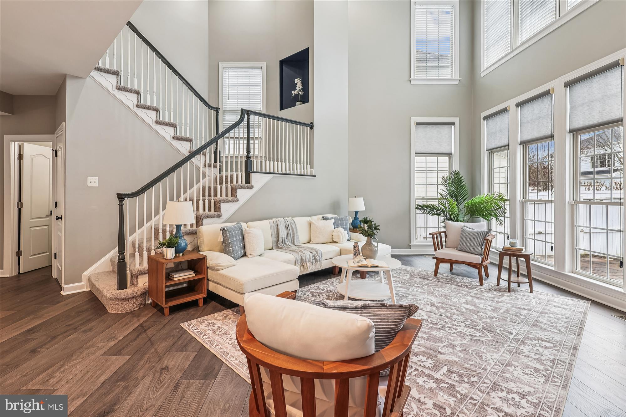 706 Crisfield Way Annapolis, MD 21401 - Photo 17 of 71 a living room with furniture a table and wooden floor