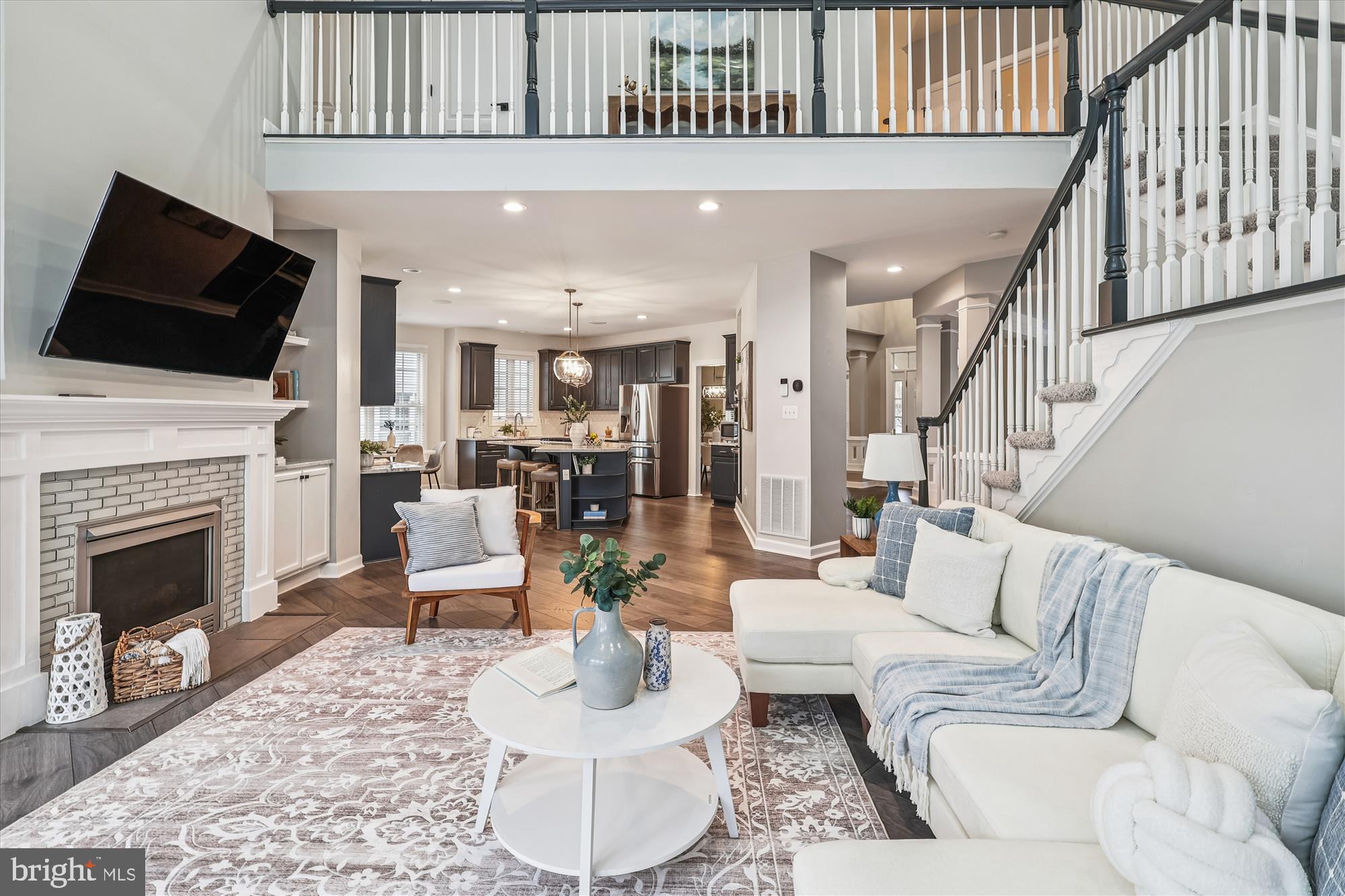 706 Crisfield Way Annapolis, MD 21401 - Photo 18 of 71 a living room with furniture a fireplace and a flat screen tv