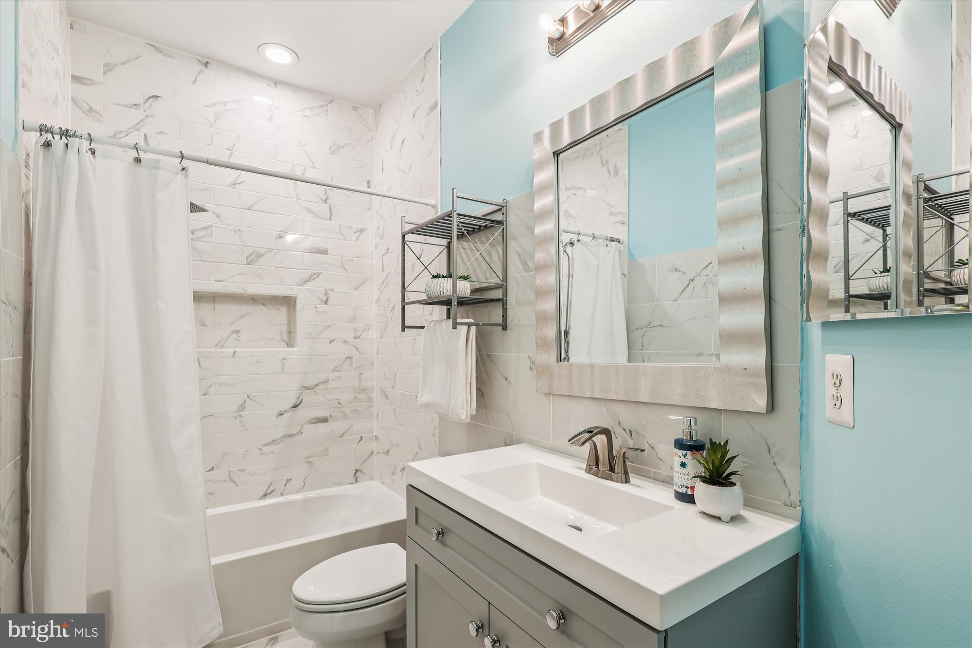 706 Crisfield Way Annapolis, MD 21401 - Photo 32 of 71 a bathroom with a sink toilet tub and shower