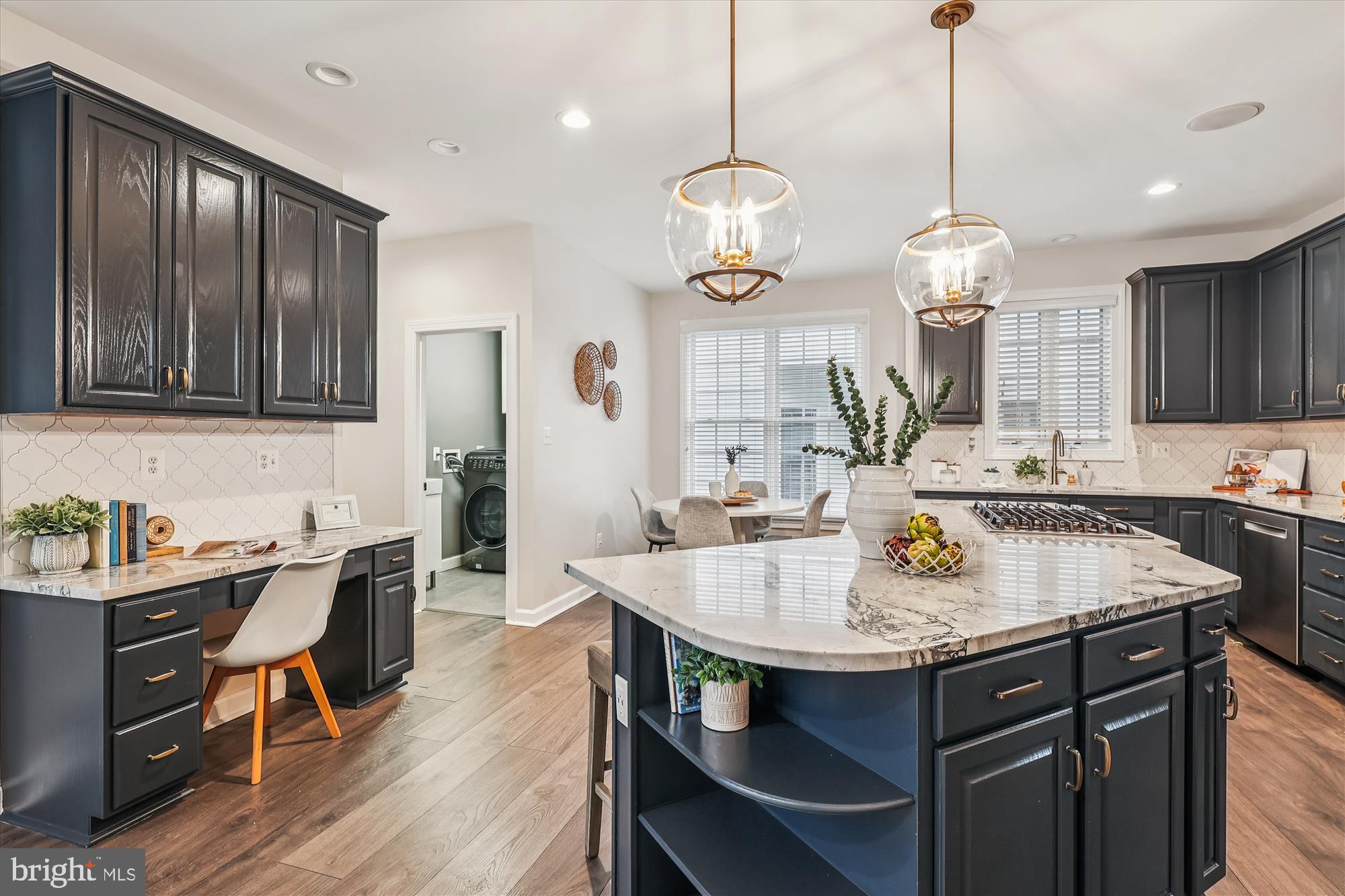 706 Crisfield Way Annapolis, MD 21401 - Photo 4 of 71 a kitchen with a counter space dining table and chairs