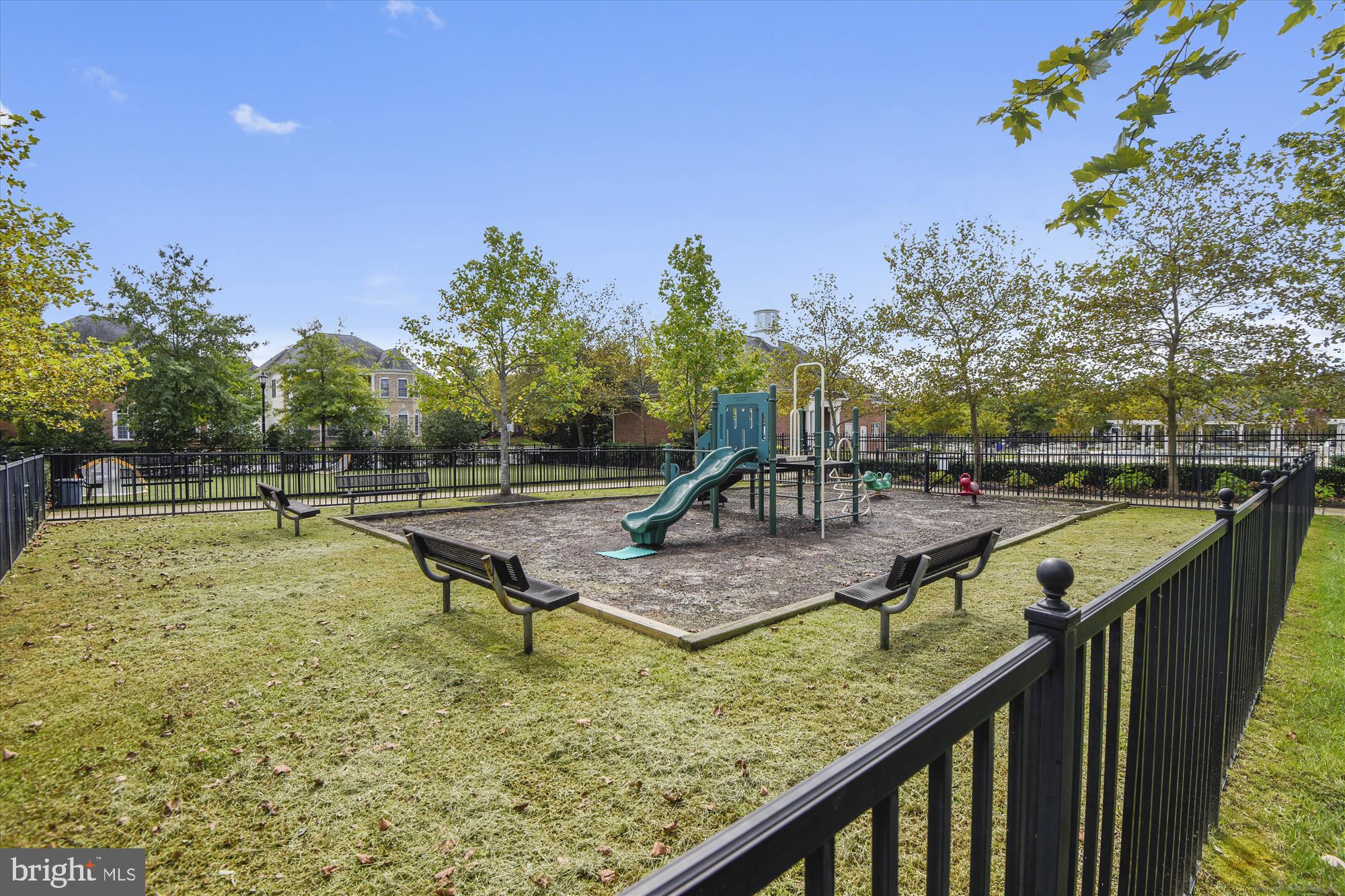 706 Crisfield Way Annapolis, MD 21401 - Photo 61 of 71 a view of a swimming pool with a bench and trees around