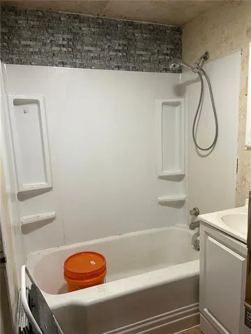 a bathroom with a sink and a shower
