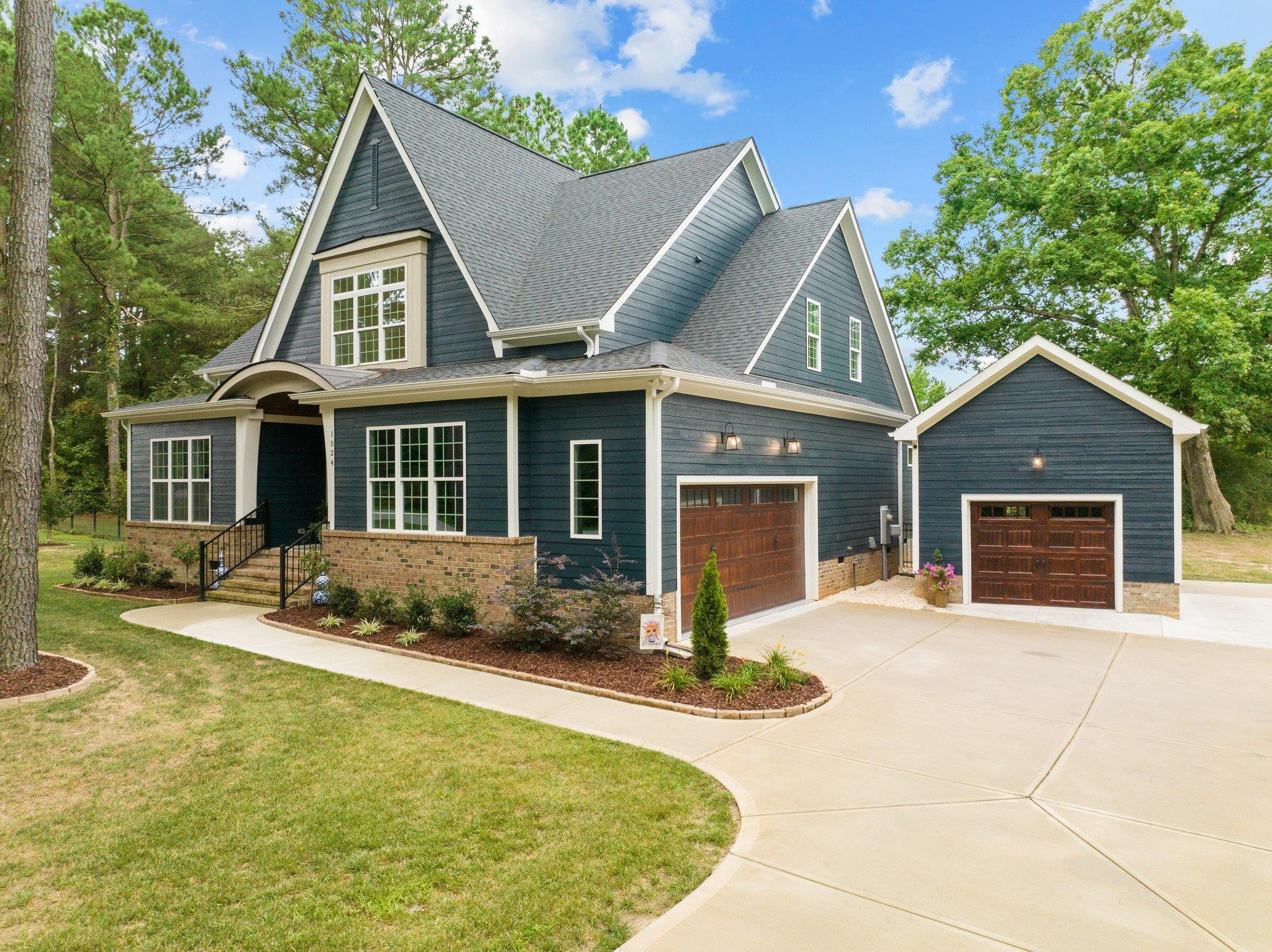 1524 Chalk Road Wake Forest, NC 27587 - Photo 1 of 63 a front view of a house with yard