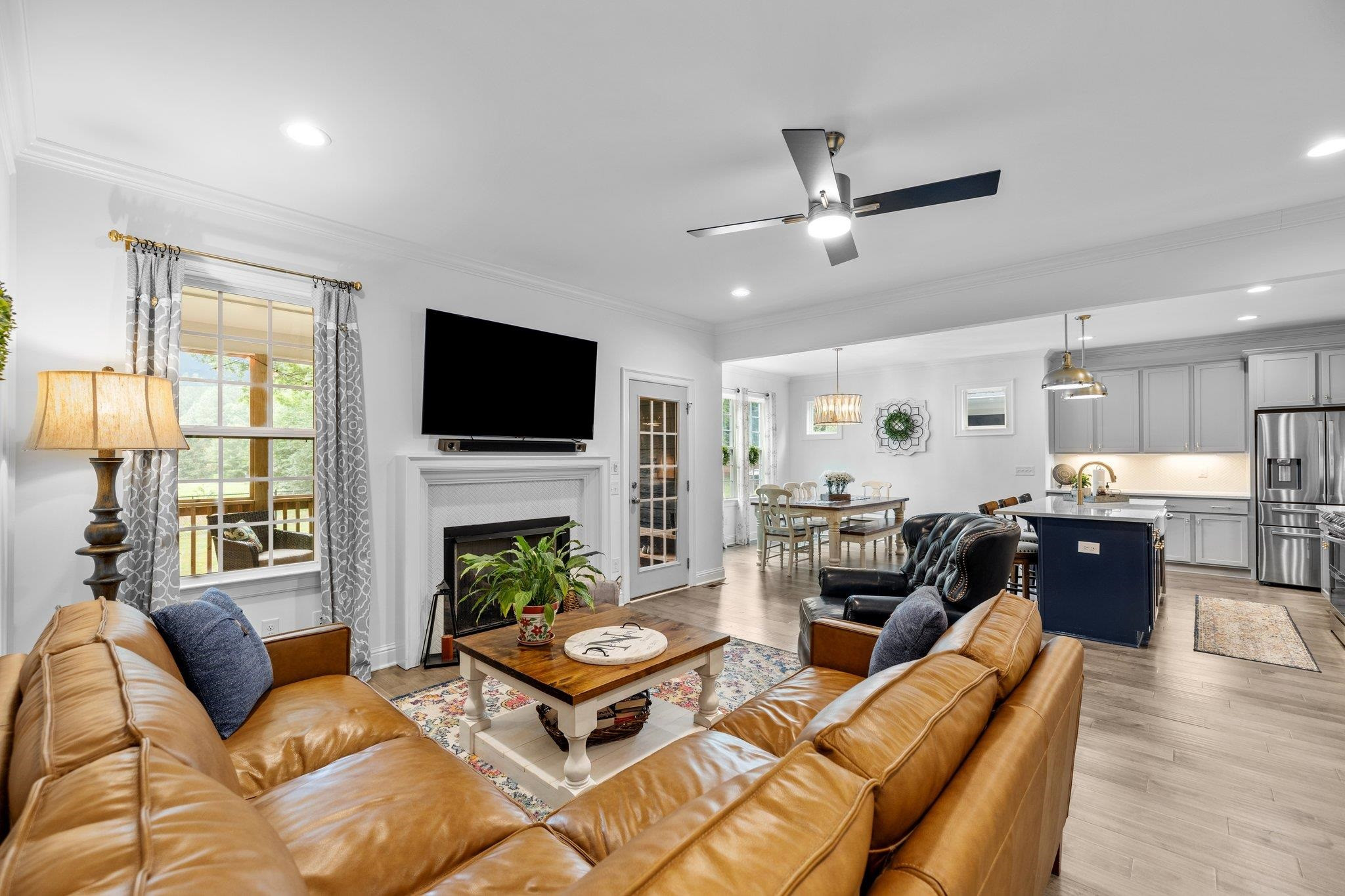 1524 Chalk Road Wake Forest, NC 27587 - Photo 16 of 63 a living room with furniture a fireplace and a flat screen tv