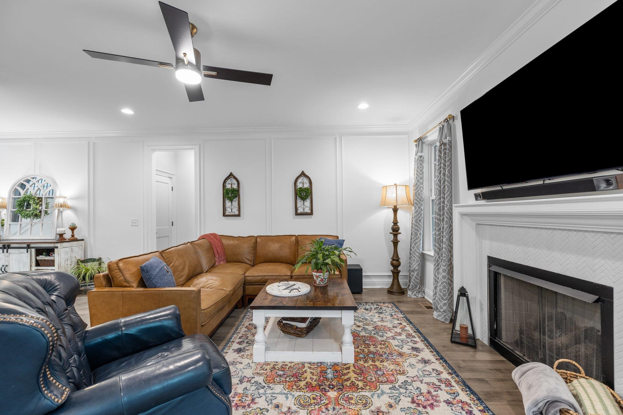 1524 Chalk Road Wake Forest, NC 27587 - Photo 17 of 63 a living room with furniture a flat screen tv and a fireplace