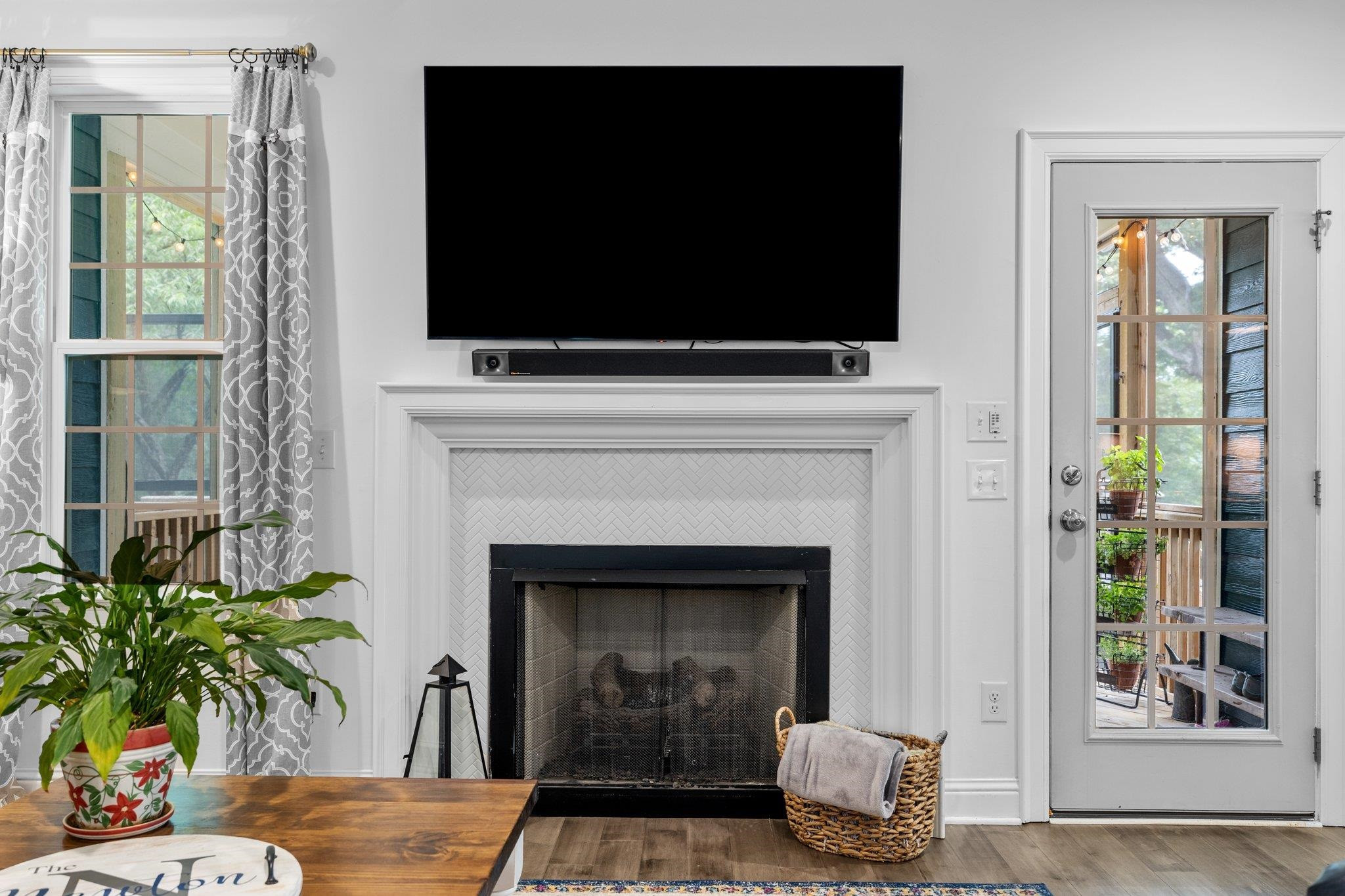 1524 Chalk Road Wake Forest, NC 27587 - Photo 18 of 63 a living room with a fireplace and a flat screen tv