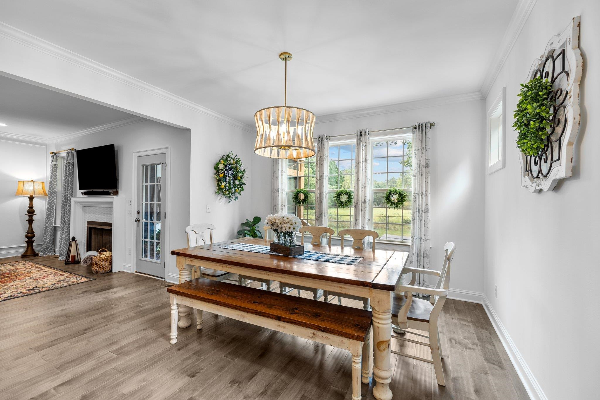 1524 Chalk Road Wake Forest, NC 27587 - Photo 27 of 63 a living room with furniture a window and a fireplace