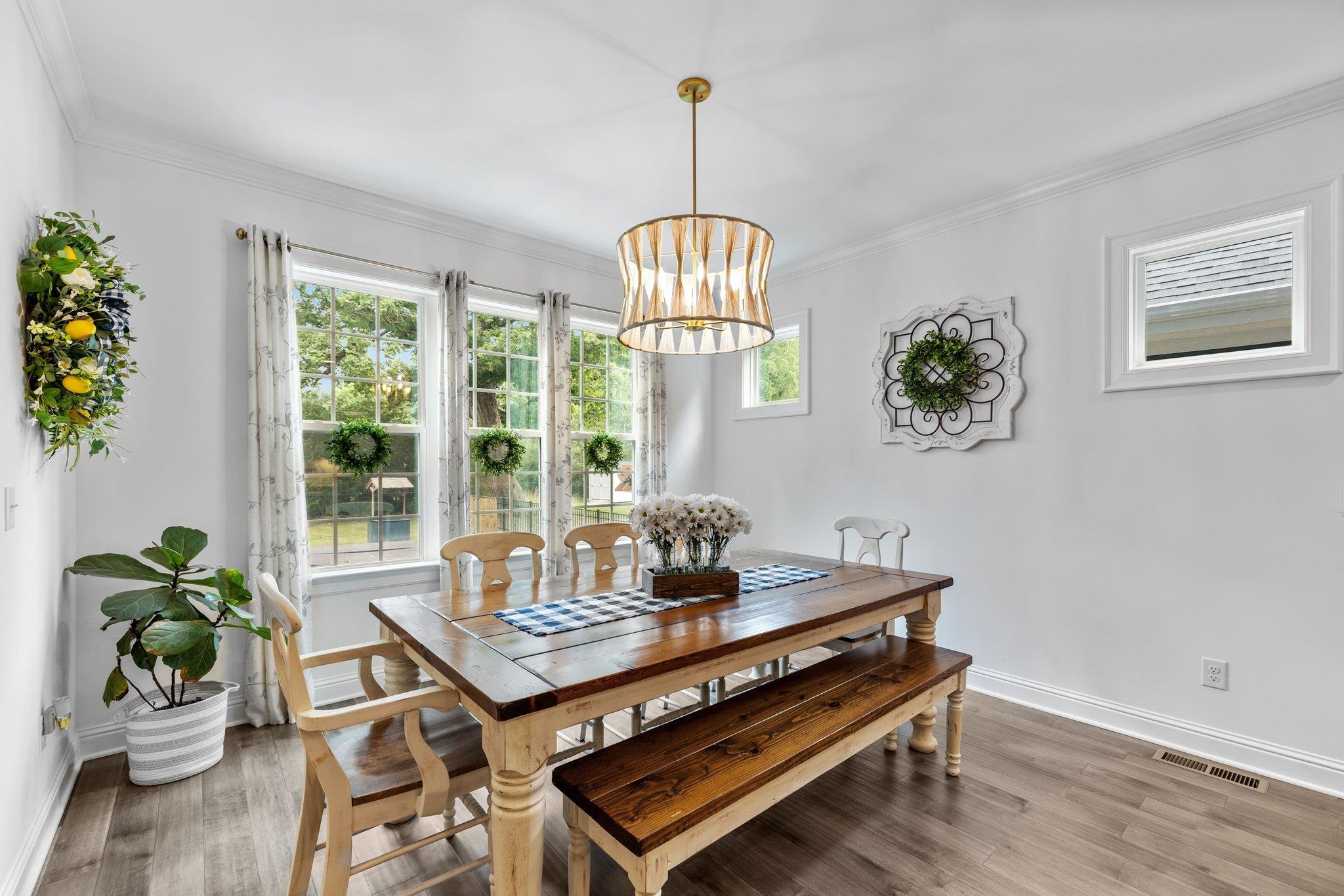 1524 Chalk Road Wake Forest, NC 27587 - Photo 28 of 63 a view of a dining room with furniture a chandelier and wooden floor