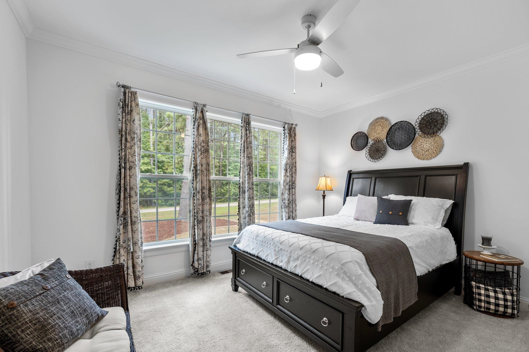 1524 Chalk Road Wake Forest, NC 27587 - Photo 29 of 63 a bedroom with a bed and a chandelier