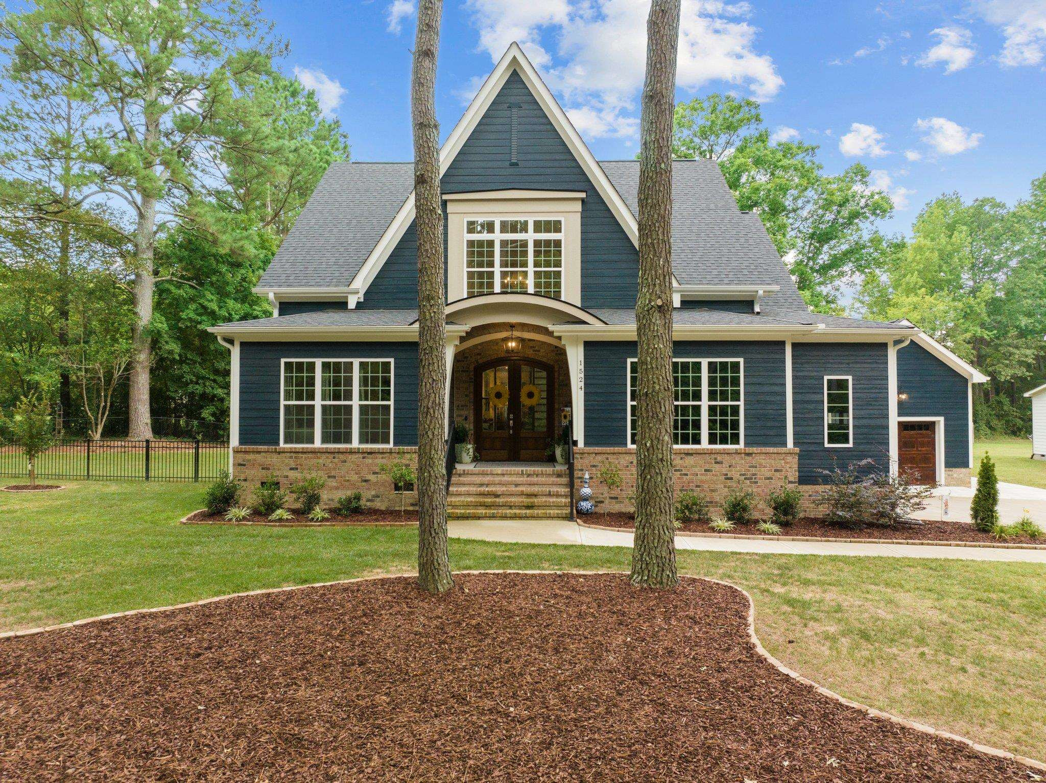 1524 Chalk Road Wake Forest, NC 27587 - Photo 3 of 63 a front view of a house with a yard