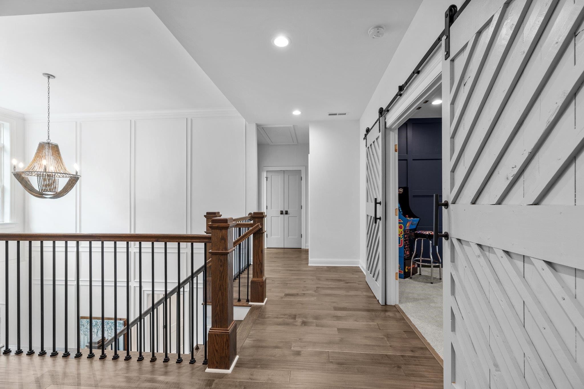 1524 Chalk Road Wake Forest, NC 27587 - Photo 36 of 63 a view of a hallway with wooden floor and stairs