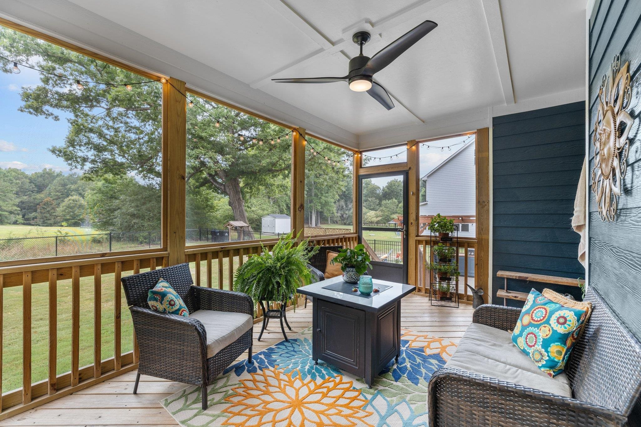 1524 Chalk Road Wake Forest, NC 27587 - Photo 47 of 63 a living room with furniture and a floor to ceiling window