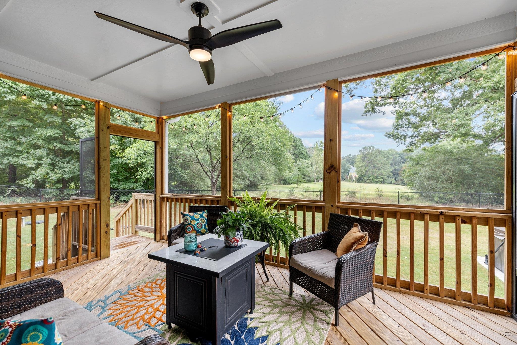 1524 Chalk Road Wake Forest, NC 27587 - Photo 48 of 63 a living room with furniture and a floor to ceiling window