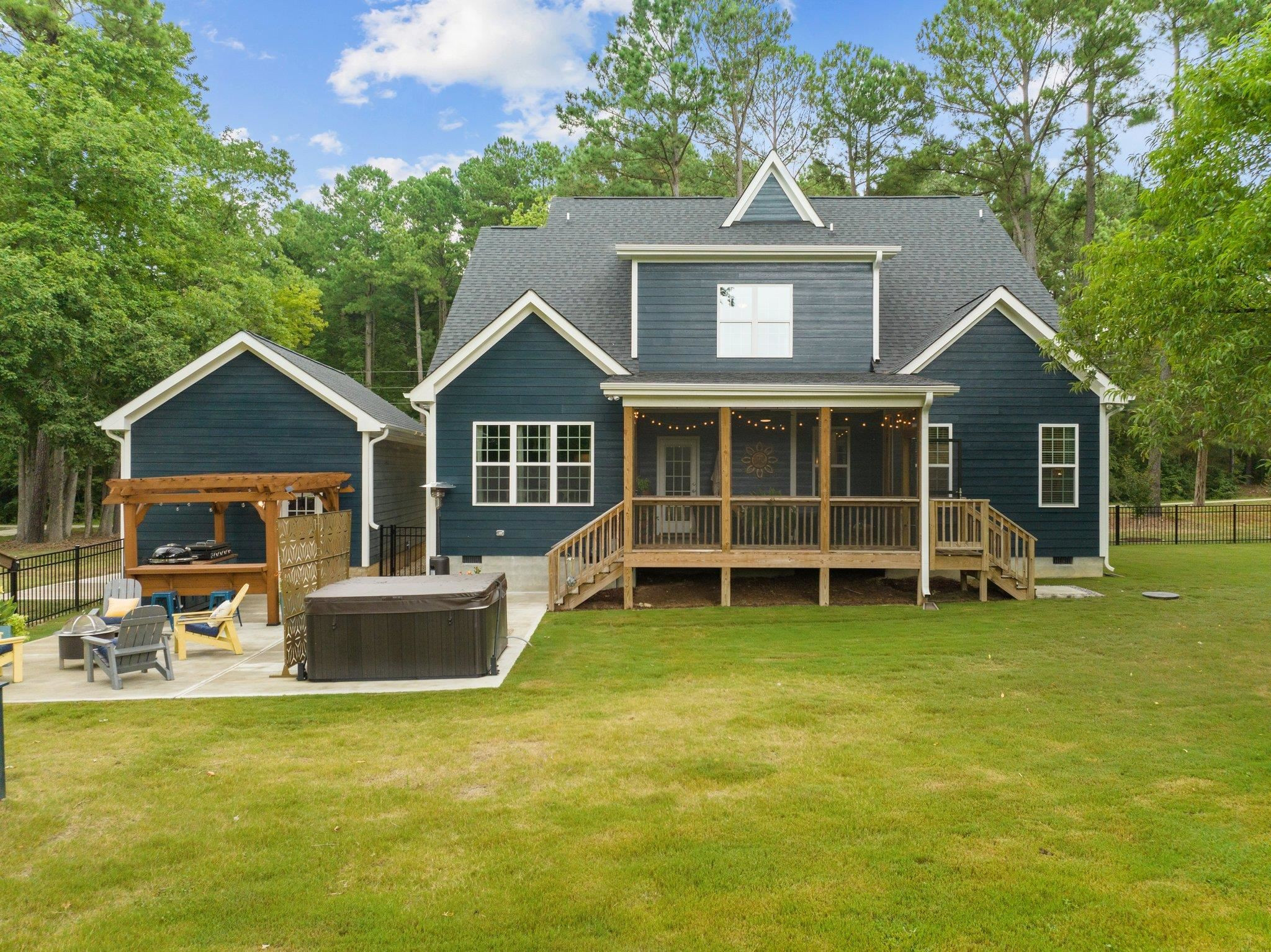 1524 Chalk Road Wake Forest, NC 27587 - Photo 50 of 63 a front view of a house with a garden and porch